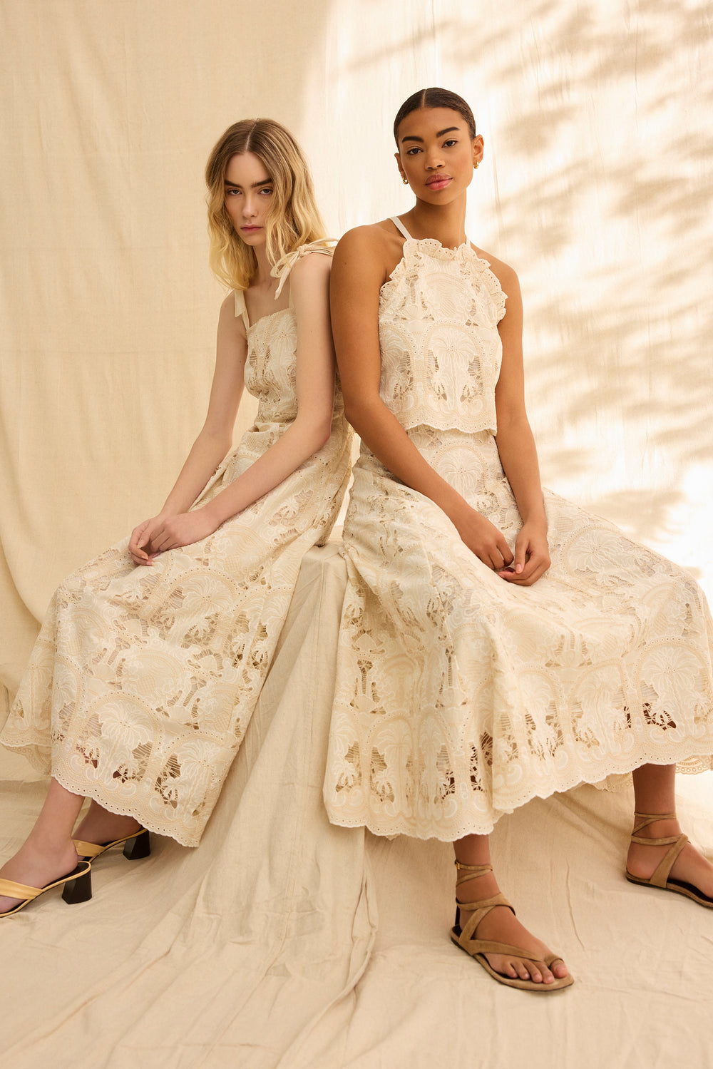 Cream embroidered top with a scallop hem