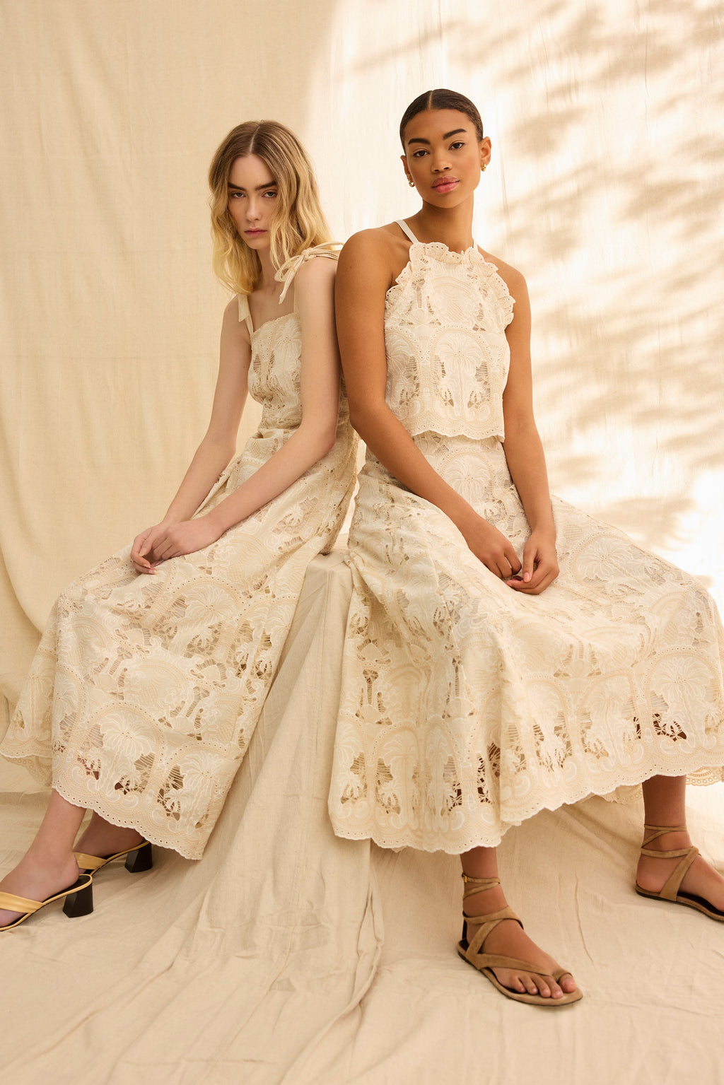 Cream embroidered top with a scallop hem