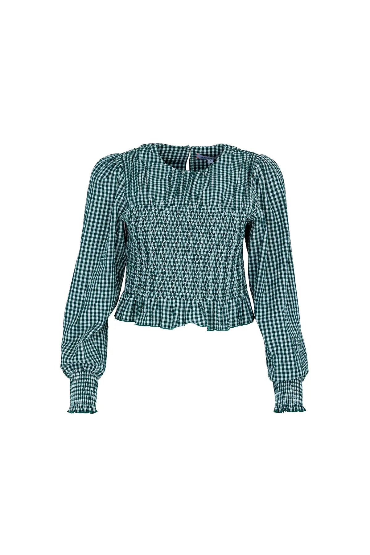 The Eubanks Top has a fitted bodice, puff sleeves, smocked cuffs, shirred yoke, and purl edge trim.