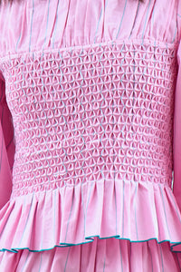 The Eubanks Top in Watermelon Stripe has a fitted bodice, puff sleeves, and smocked cuffs