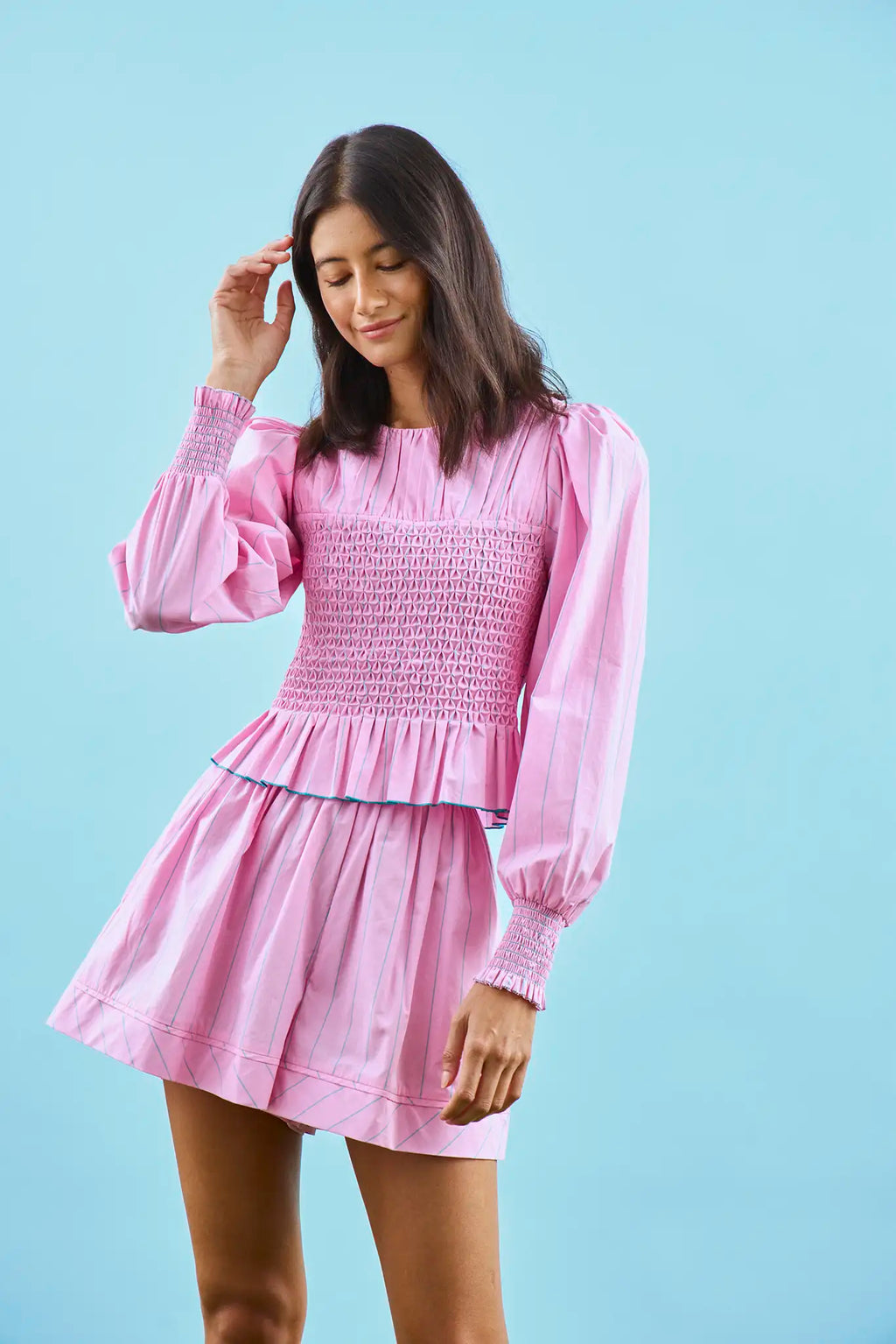 The Eubanks Top in Watermelon Stripe has a fitted bodice, puff sleeves, and smocked cuffs