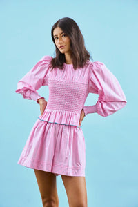 The Eubanks Top in Watermelon Stripe has a fitted bodice, puff sleeves, and smocked cuffs