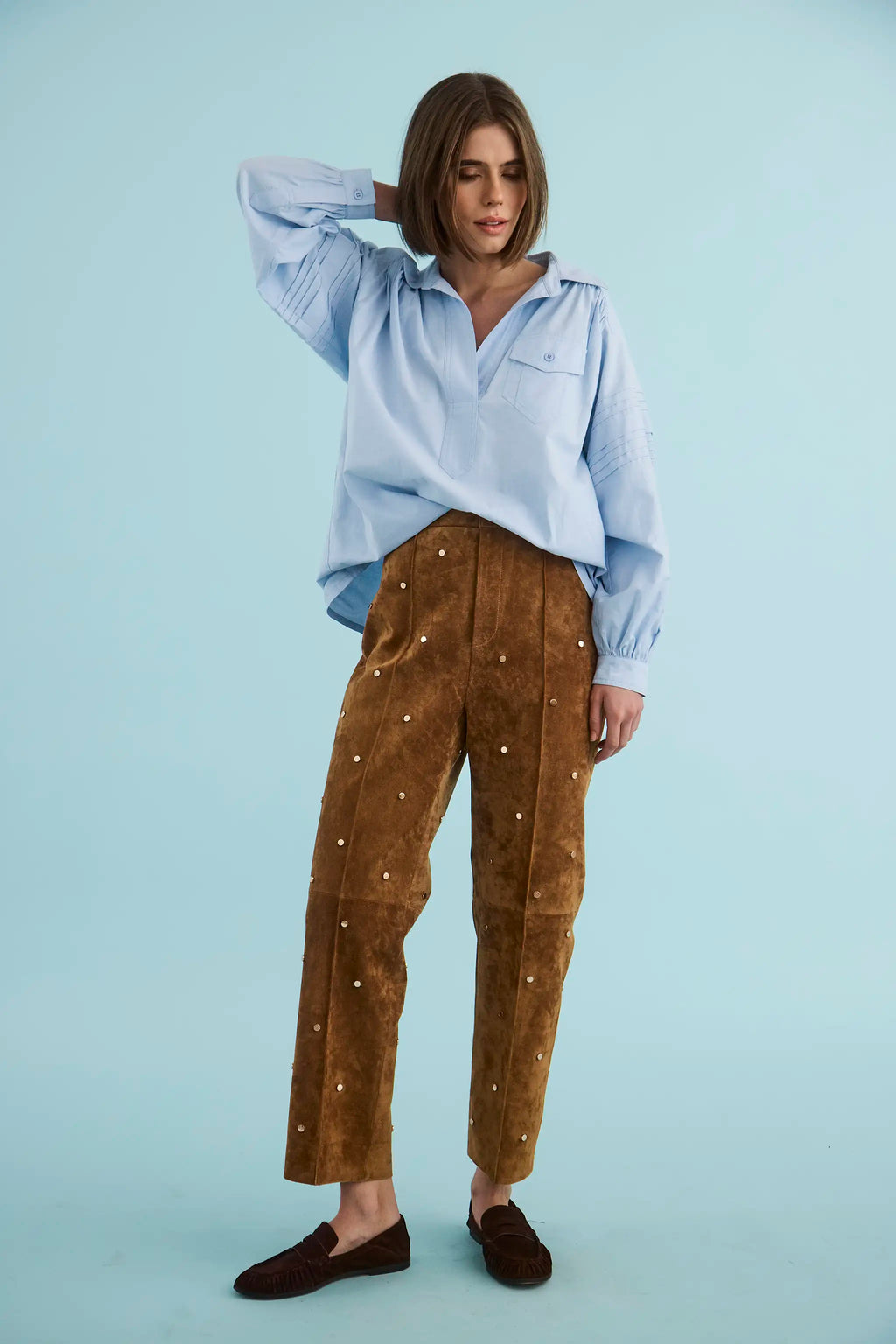 The Evangeline Shirt in Oxford Blue paired with the Hills Pant in Saddle.