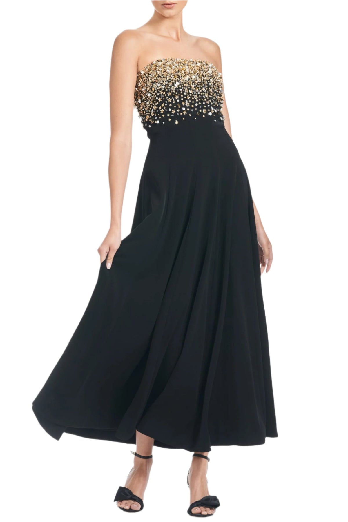 Front view of Bettany Gown in Black showcasing gold embellished strapless bodice and flowing skirt on white background