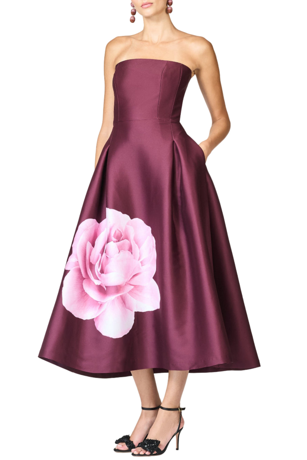Front view of Shay strapless tea-length dress showing fitted bodice and A-line mikado skirt with large pink floral print on white background