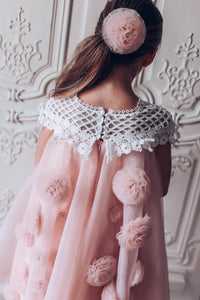 Back view of a girls pink tulle flower dress with lace bodice 