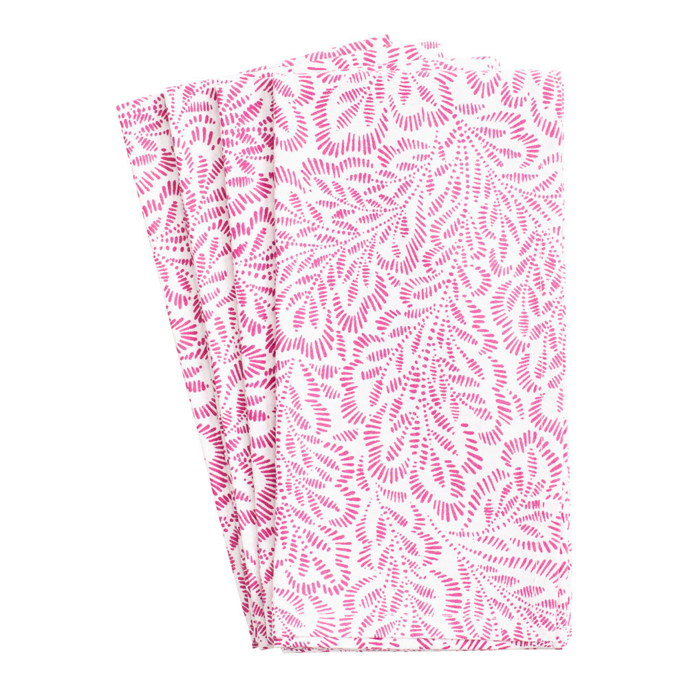 Front view of Block Print Leaves cotton dinner napkins showcasing fuchsia and white leaf pattern with a white background