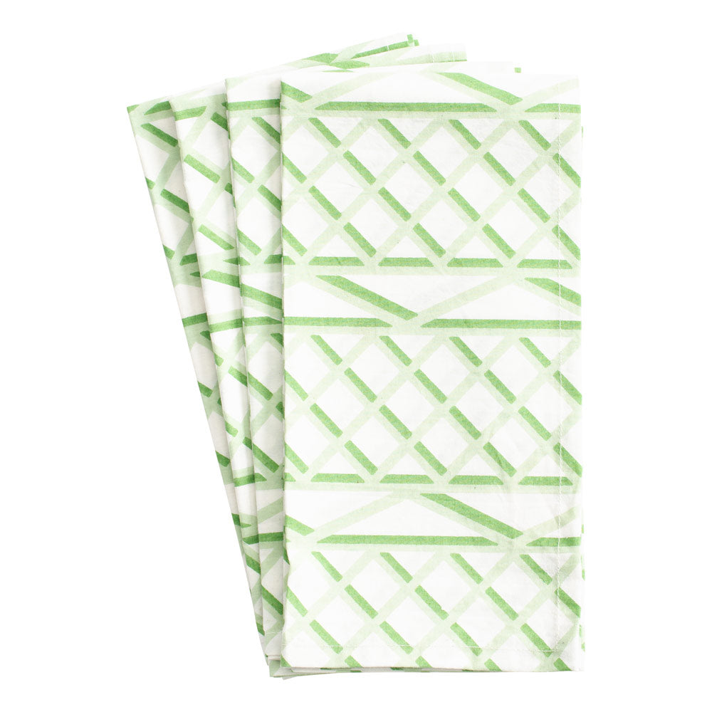 Front view of Trellis Cotton Dinner Napkins, set of 4, showcasing a green and white geometric fretwork pattern on a white background