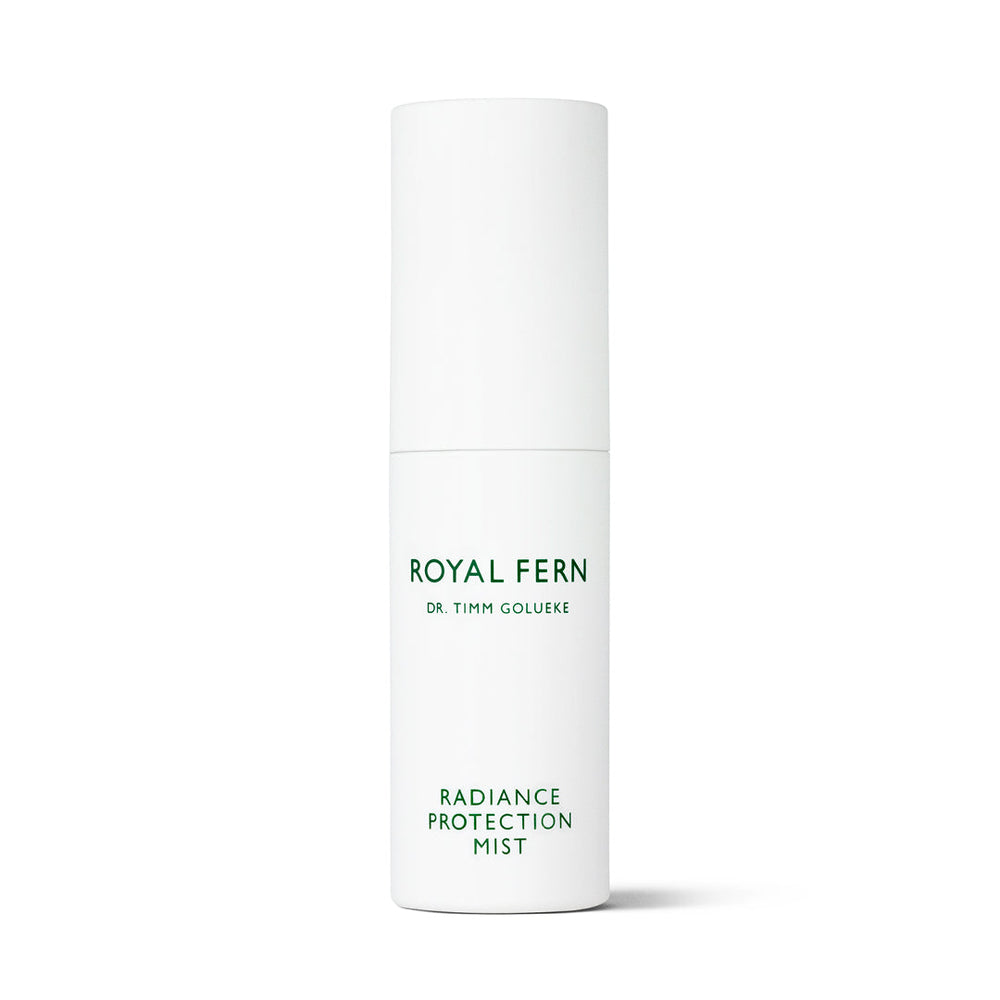 Front view of Radiance Protection Mist showcasing its white cylindrical bottle with a white background