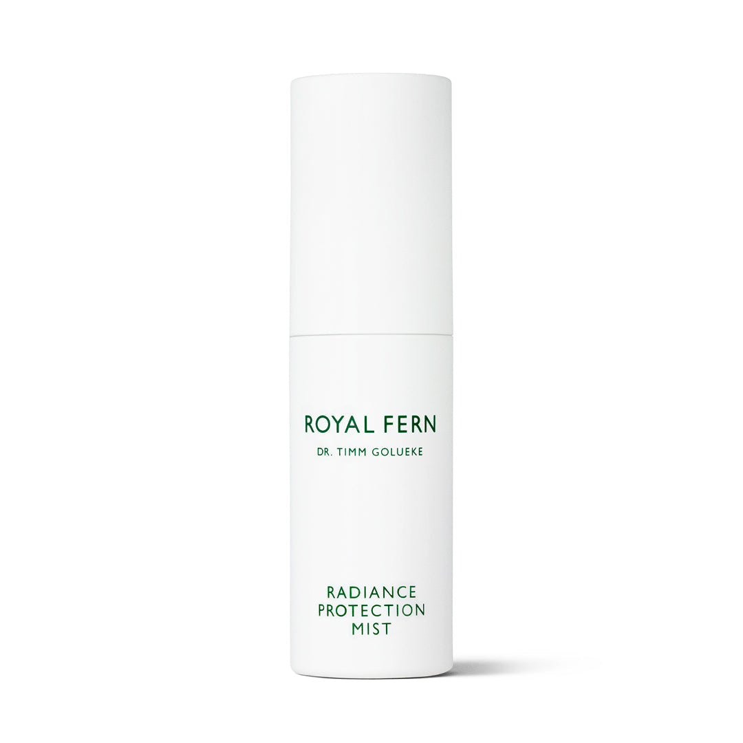 Front view of Radiance Protection Mist showcasing its white cylindrical bottle with a white background