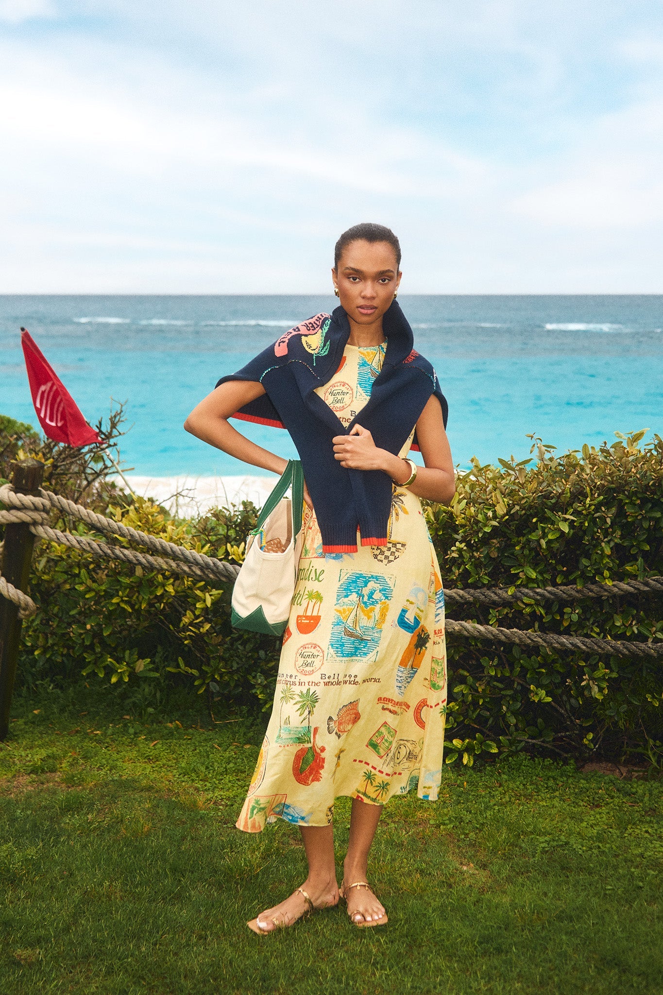 The Faith Dress in Wish You Were Here print paired with St. Georges Sweater.