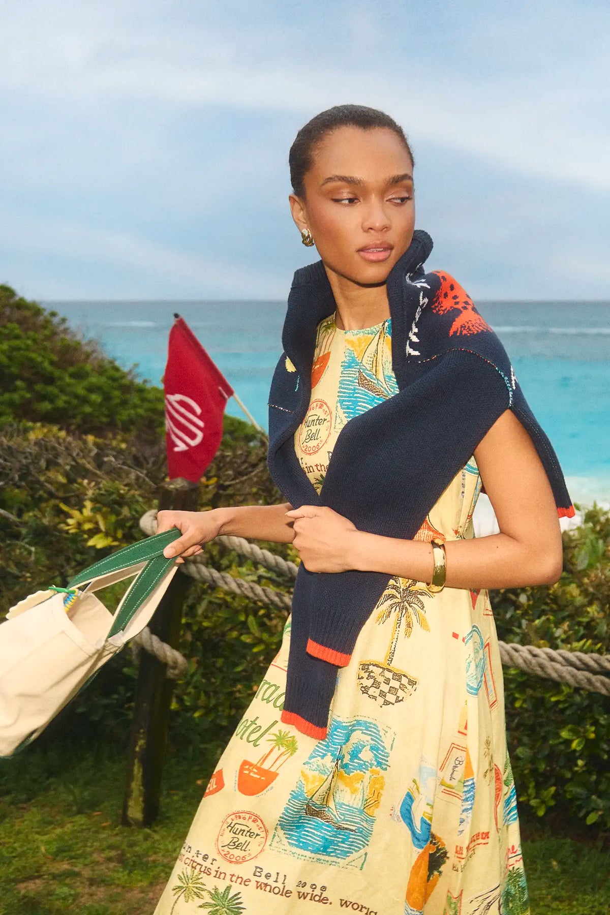 The Faith Dress in Wish You Were Here print paired with St. Georges Sweater.