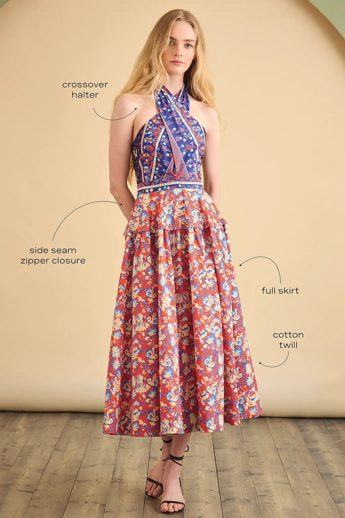 The Bellamy Dress is a criss cross halter dress with a full skirt and a clean side seam zipper.