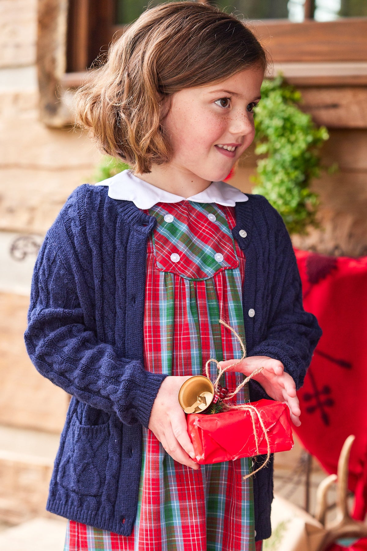 Little English traditional children's clothing, Fallon dress in red, blue, and green highlands tartan pattern with buttons on chest, for little girl