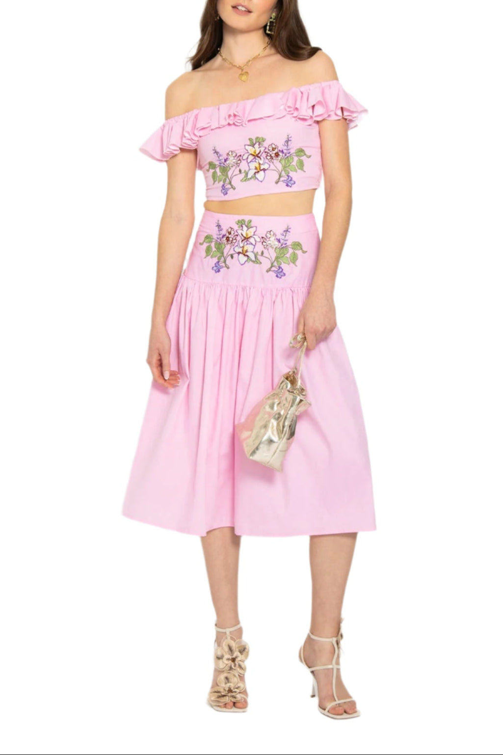 Front view of Ulviye Skirt Set: pink off-shoulder ruffled crop top and embroidered midi skirt on model, white background