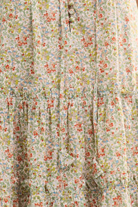Close up of The Fawn Dress in Coral Multi.