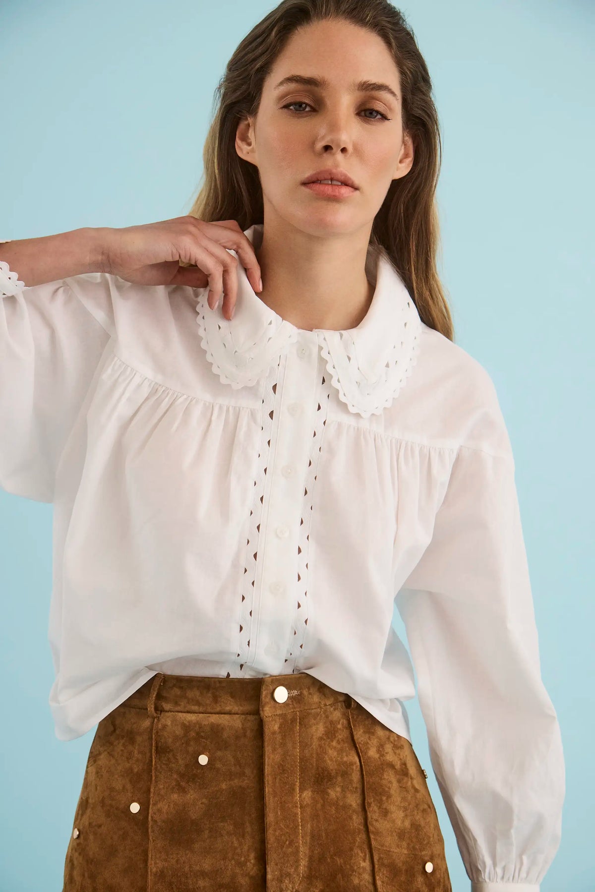 The Finch Top in White paired with the Hills Pant in Saddle. 