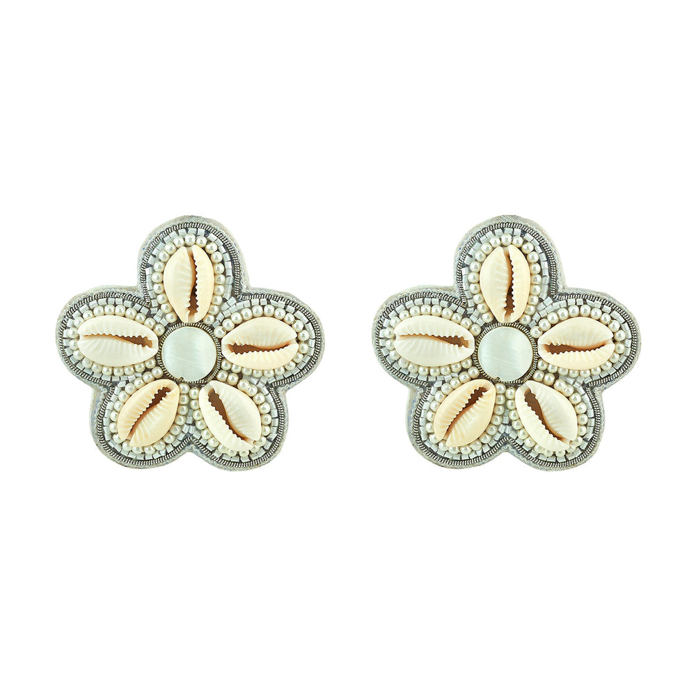 Front view of Fiona stud earrings showing flower shape with five puka shells and pearl bead accents on white background