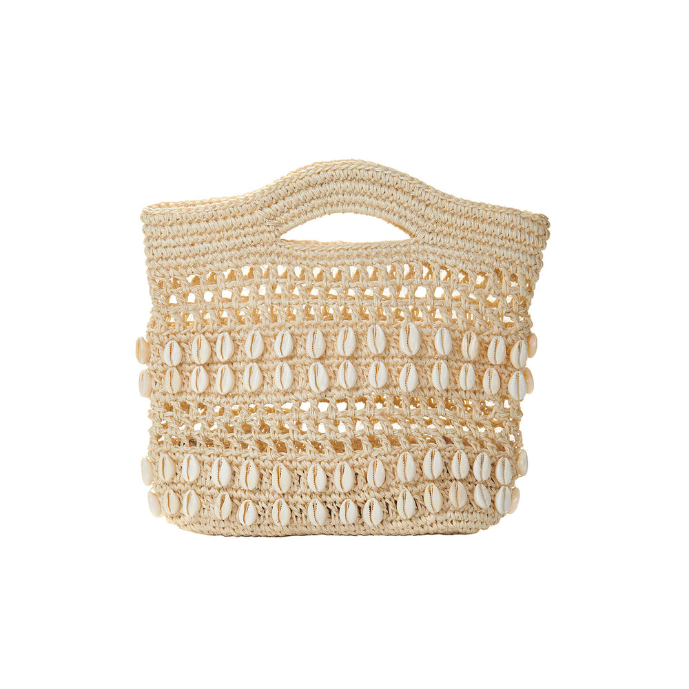 Front view of Fiona Mini Bag showing woven straw body, cowrie shell rows, and cutout top handle on white background