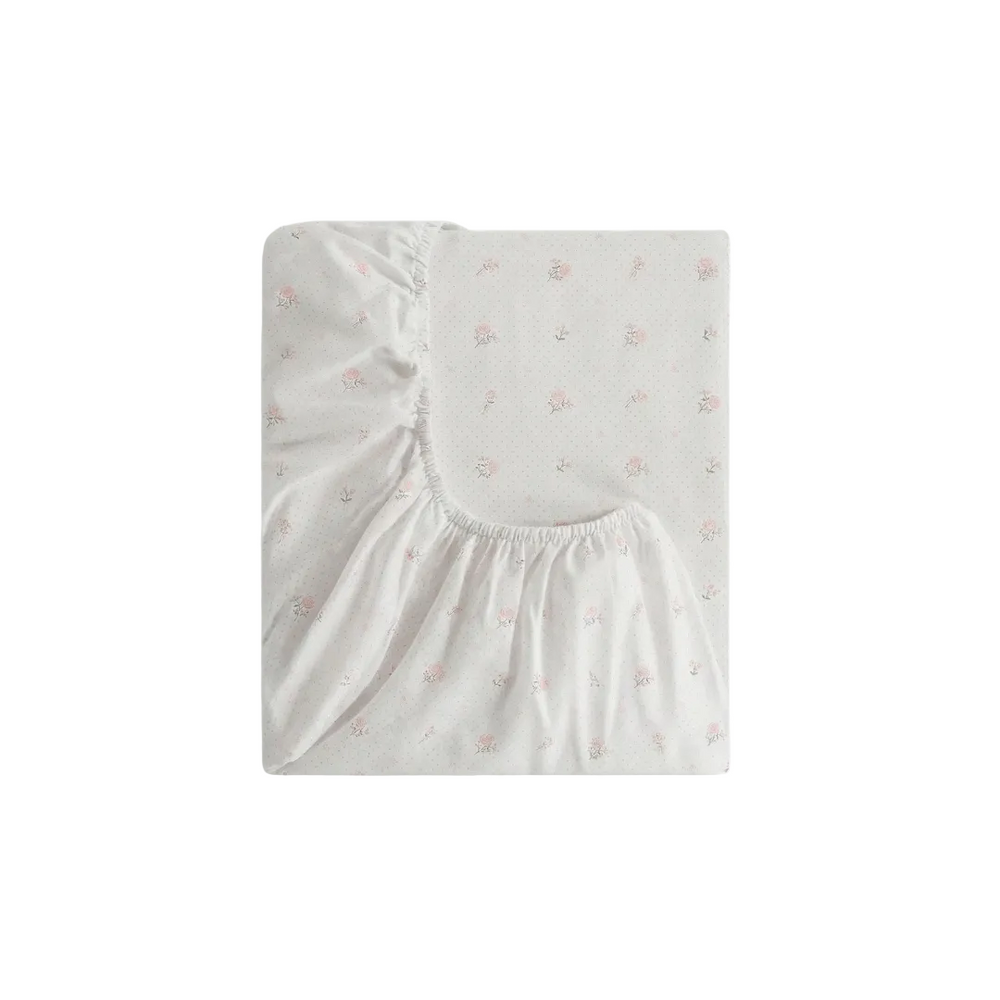 Floral patterned crib sheet fitted sheet on a white background