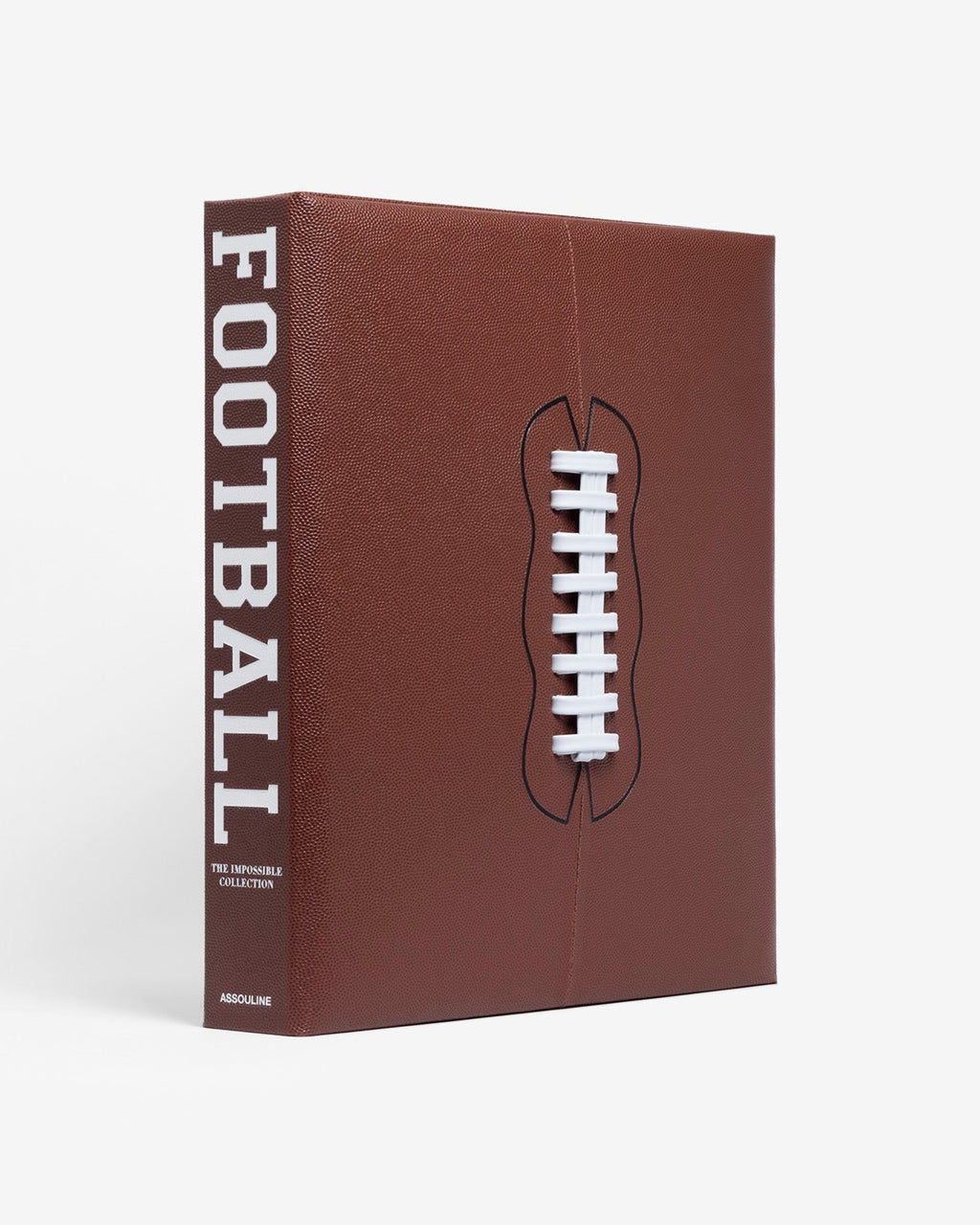 American Football: The Impossible Collection by Assouline: three-quarter angle view of the closed clamshell box; rich dark brown pebbled leather covers the box face and spine; a three-dimensional raised white football lace in relief is centered on the face; FOOTBALL in large white block type on the spine; THE IMPOSSIBLE COLLECTION and ASSOULINE in smaller white type below; white background