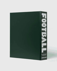 Football: The Impossible Collection by Assouline: three-quarter view of the plain back of the green leather slipcase; the dark forest green surface is completely unadorned; the spine at right reads FOOTBALL in bold white type, THE IMPOSSIBLE COLLECTION and ASSOULINE in smaller white type below; white background