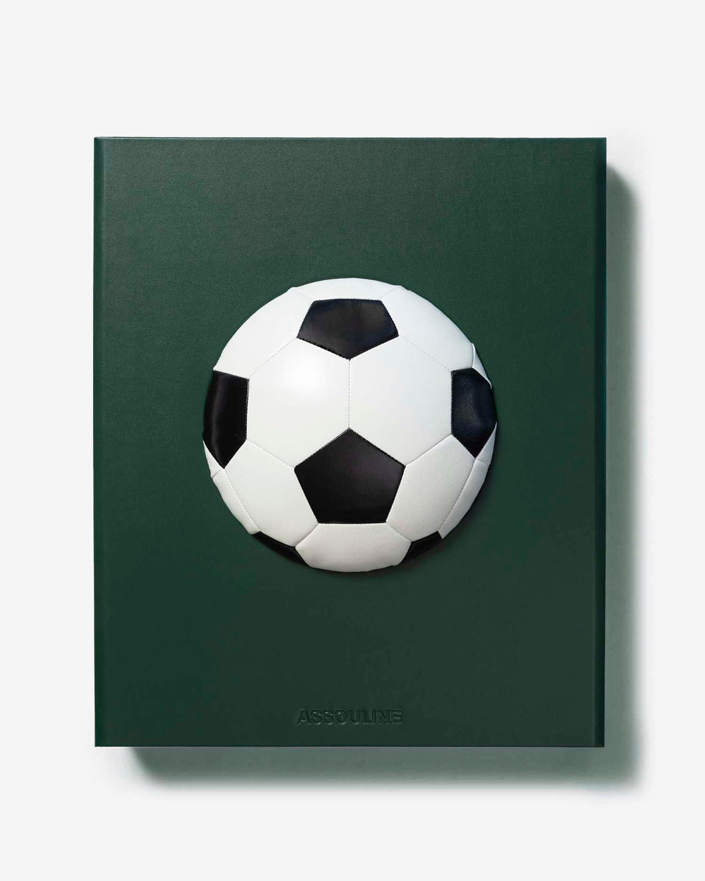 Football: The Impossible Collection by Assouline: flat front-facing view of the green leather slipcase; the dark forest green surface features a three-dimensional black-and-white soccer ball mounted at center; ASSOULINE in small embossed type at the lower center; no title text on the face; white background