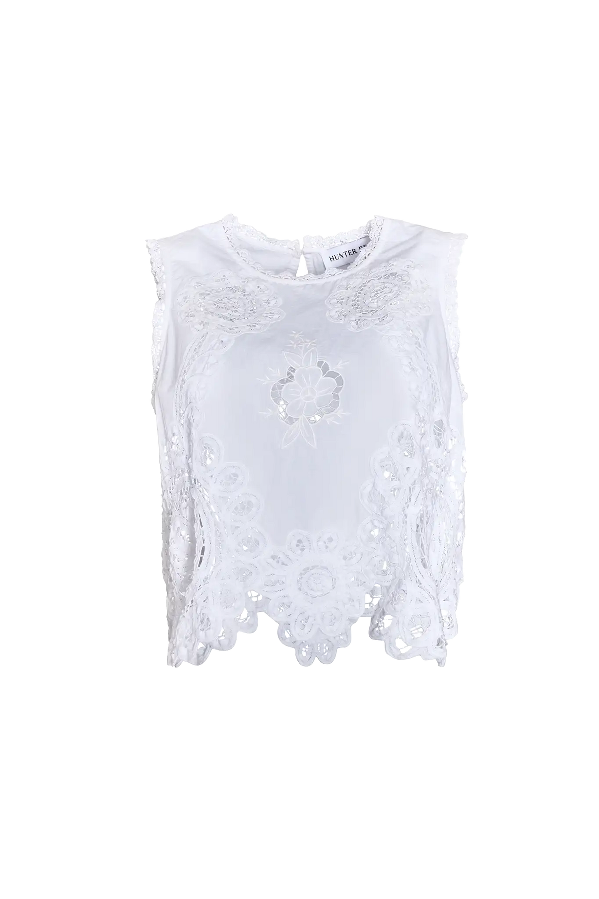 The Francesca Top in white lace has a cropped profile and sleeveless.