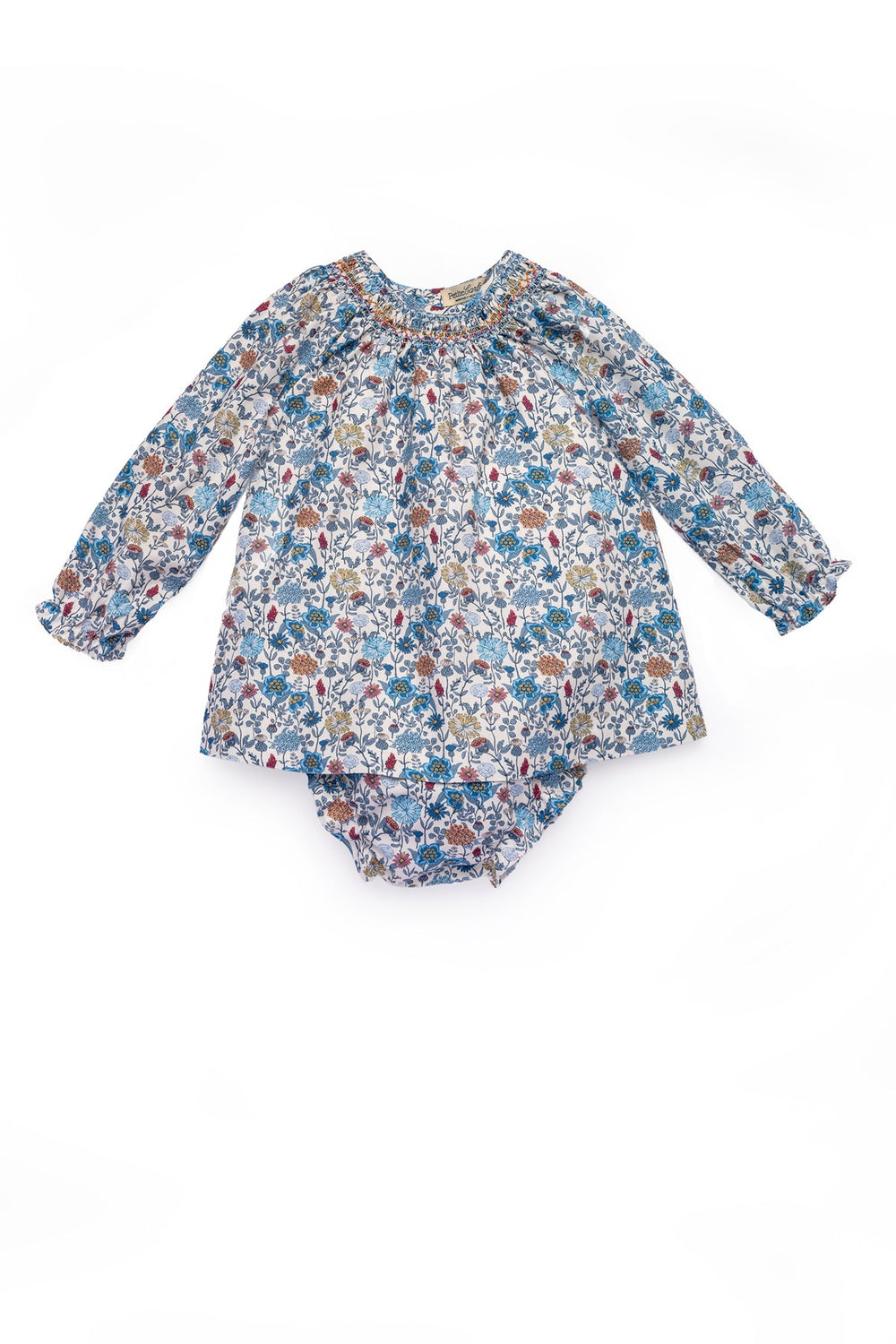 Flat lay of Cynthia short dress and matching bloomer showcasing bluebell garden floral print and smocked neckline on white background