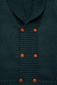Front close-up of the Felipe Sweater in Evergreen showcasing ribbed collar and caramel buttons with knit texture