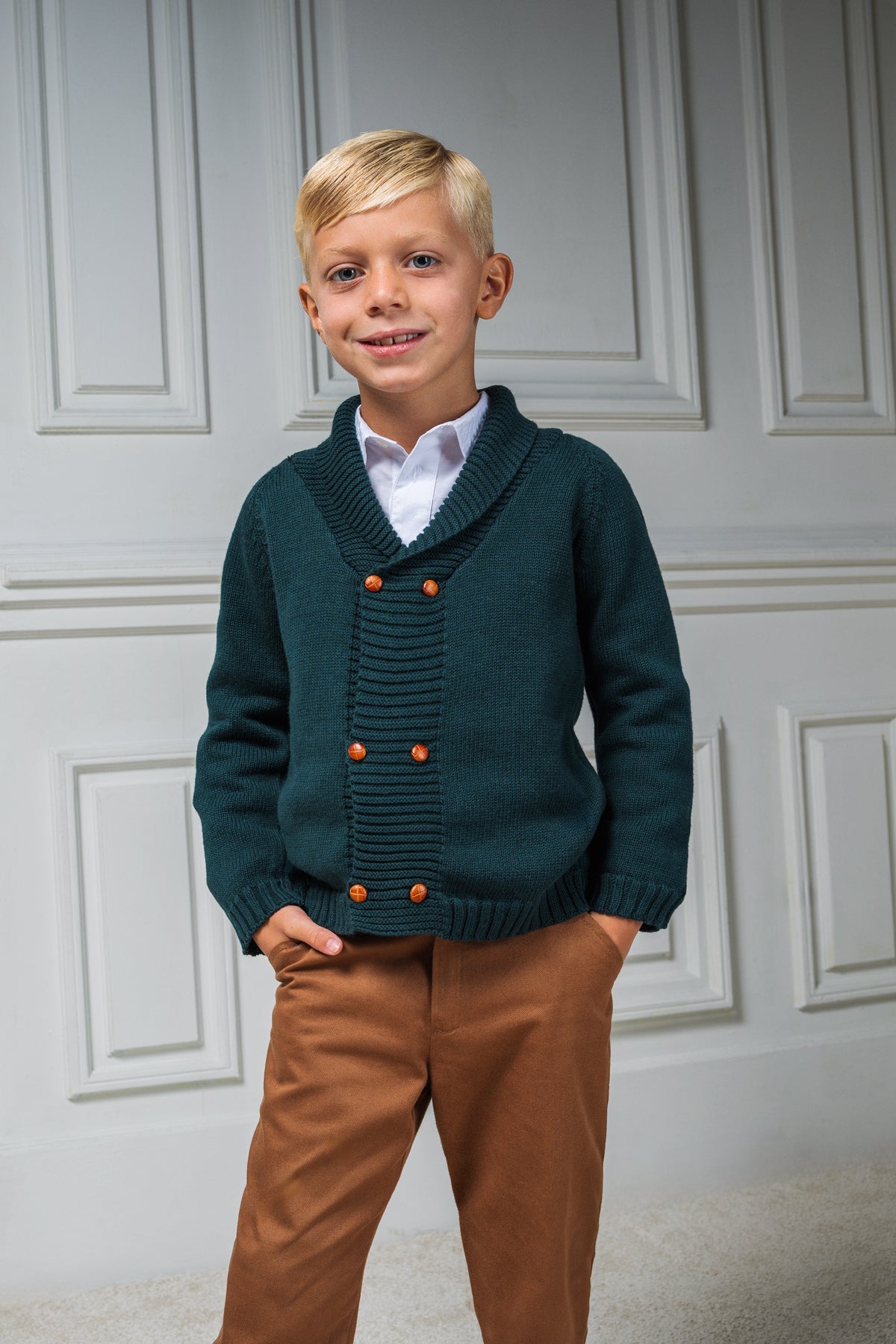 Front view of Felipe Sweater in Evergreen showcasing wide ribbed collar and caramel buttons on a child