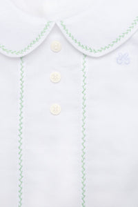 Close-up front of Eduardo Shirt in Olive showcasing Peter Pan collar and herringbone embroidery with buttons on a plain background