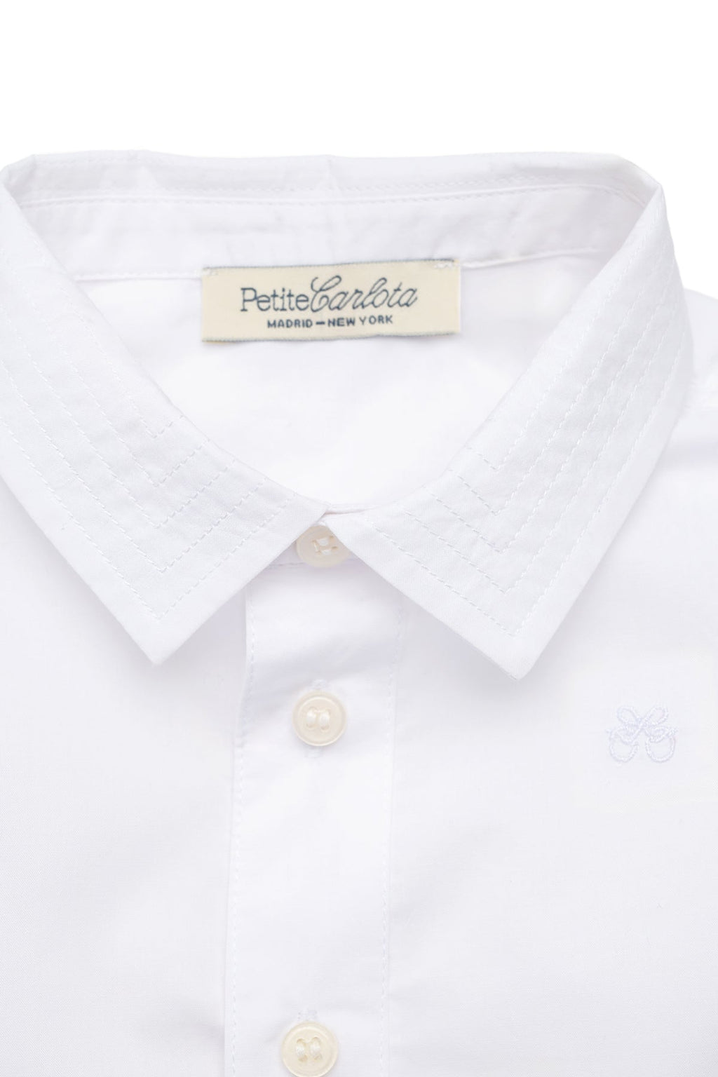 Close-up front view of Enrique Shirt in Cloud White showcasing stitched collar and button-down front on a white background