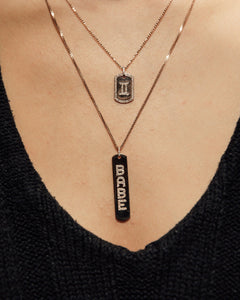 The Longtag Necklace shown in rose gold., 14k yellow gold, 14k yellow gold, 14k rose gold, 14k white gold