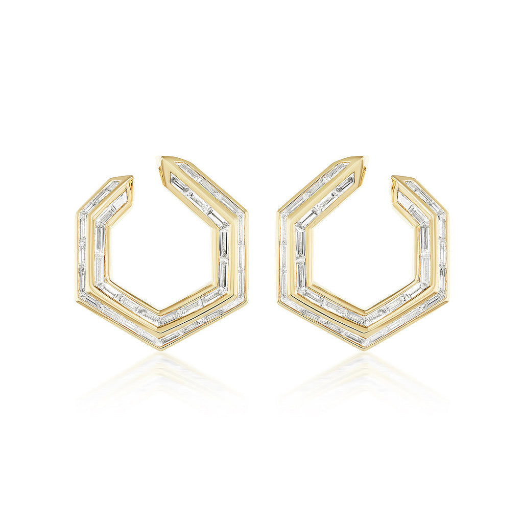 Chrysler Front-To-Back Hoops with Baguette Diamonds feature geometric hexagonal 18K gold hoops, each set with baguette diamonds outlining their modern, angular design.