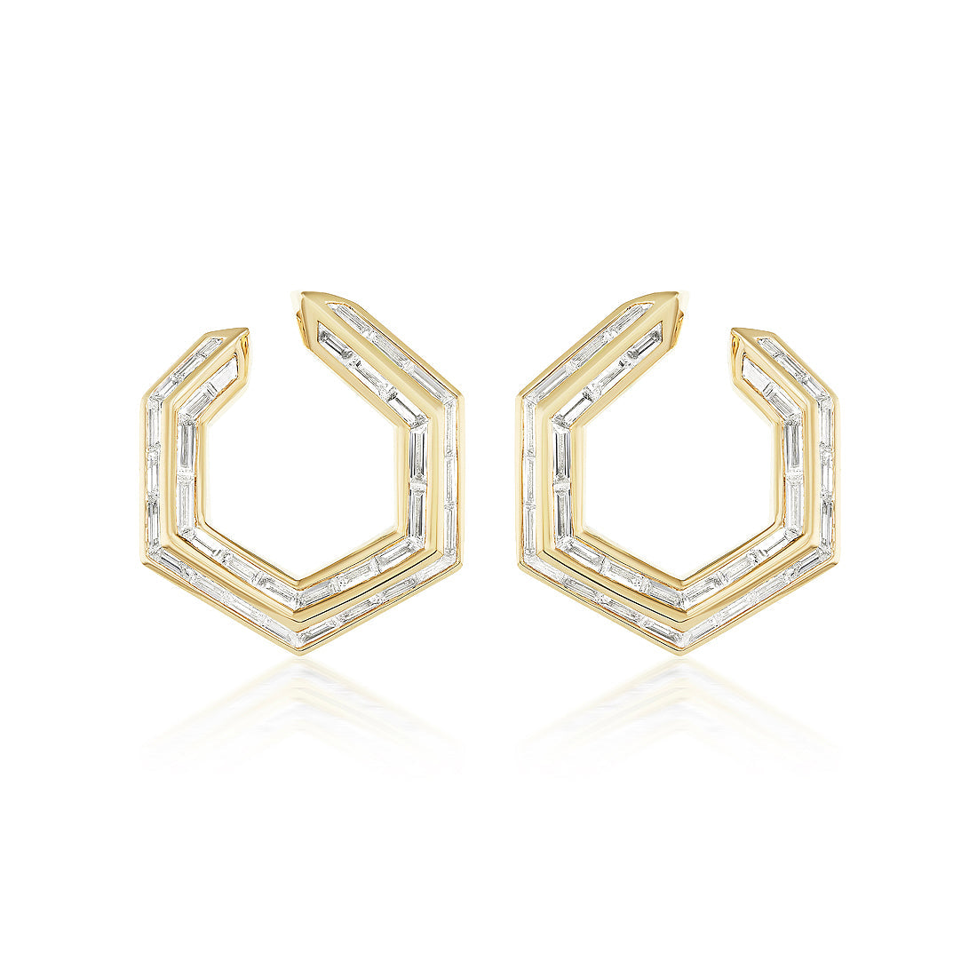Chrysler Front-To-Back Hoops with Baguette Diamonds feature geometric hexagonal 18K gold hoops, each set with baguette diamonds outlining their modern, angular design.