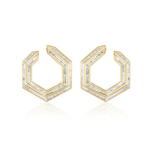 Chrysler Front-To-Back Hoops with Baguette Diamonds feature geometric hexagonal 18K gold hoops, each set with baguette diamonds outlining their modern, angular design.