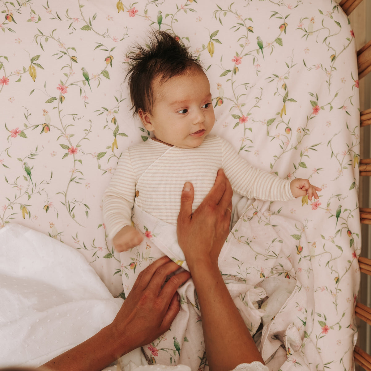 Baby laying in crib with Dreaming of Paradise Print