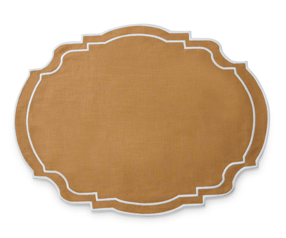 Top view of Grace placemat in camel brown linen showcasing scalloped shape and white embroidered double border on white background