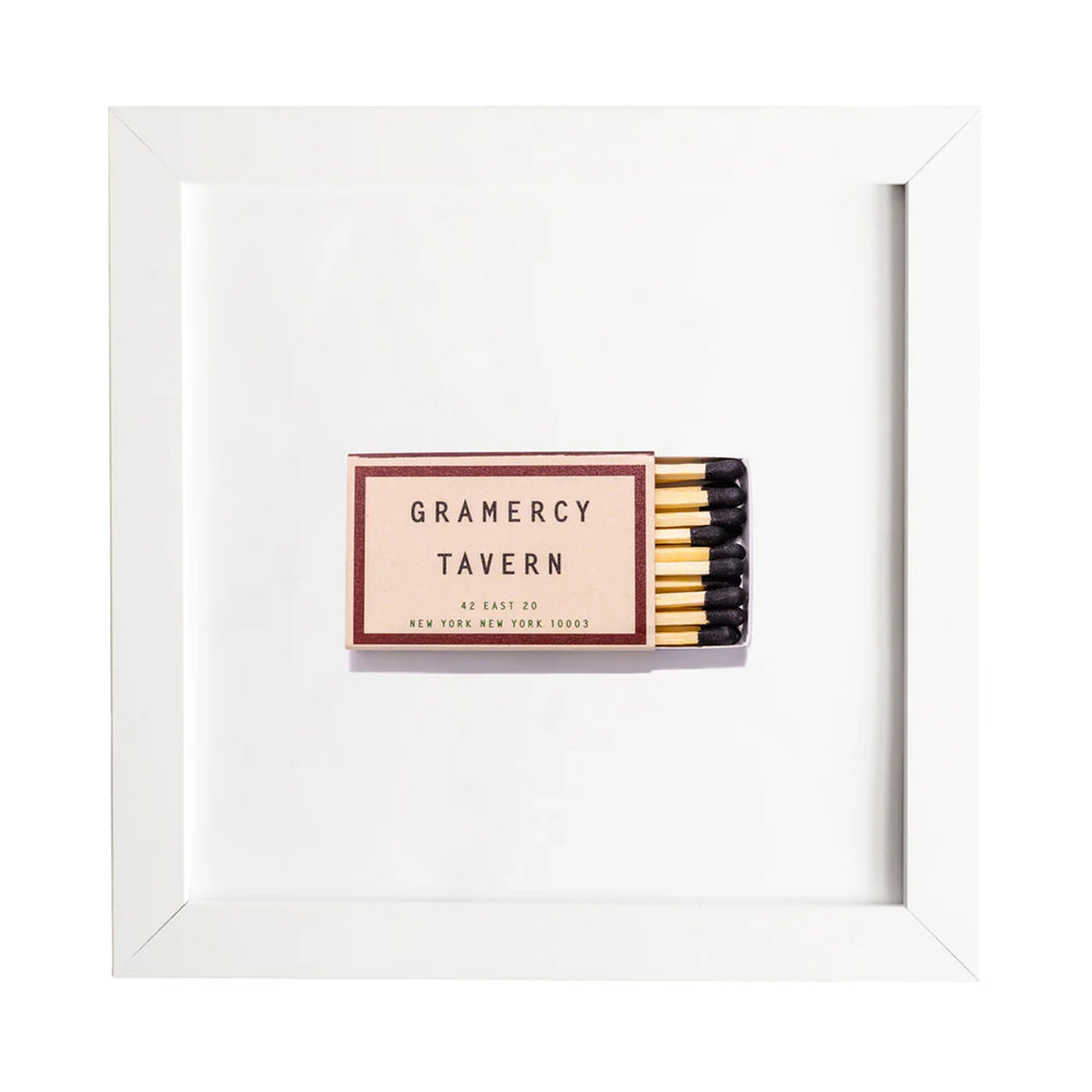 Front view of Gramercy Tavern matchbook framed print showcasing a centered vintage matchbook in a white frame on a white background