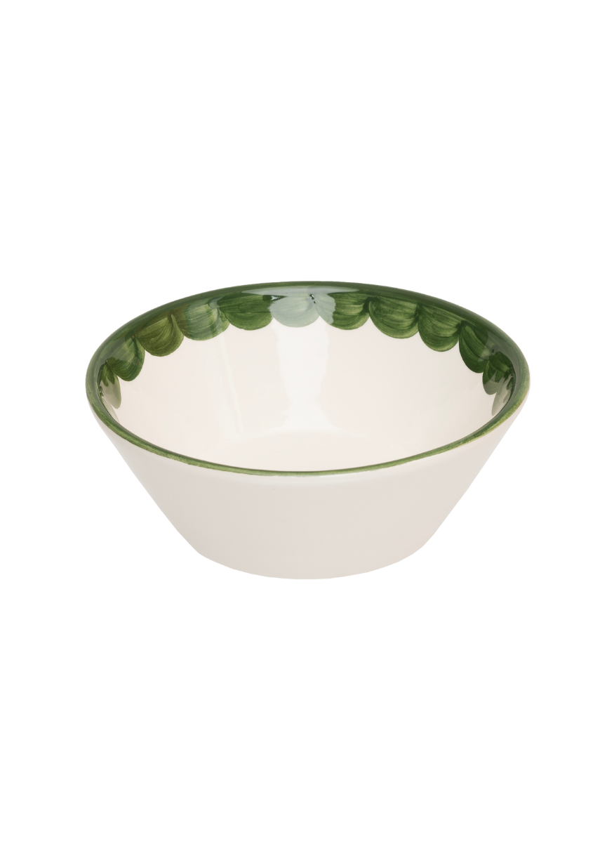 Angled view of Green Scallop bowl showcasing scalloped rim and hand painted green brushstroke interior on white background