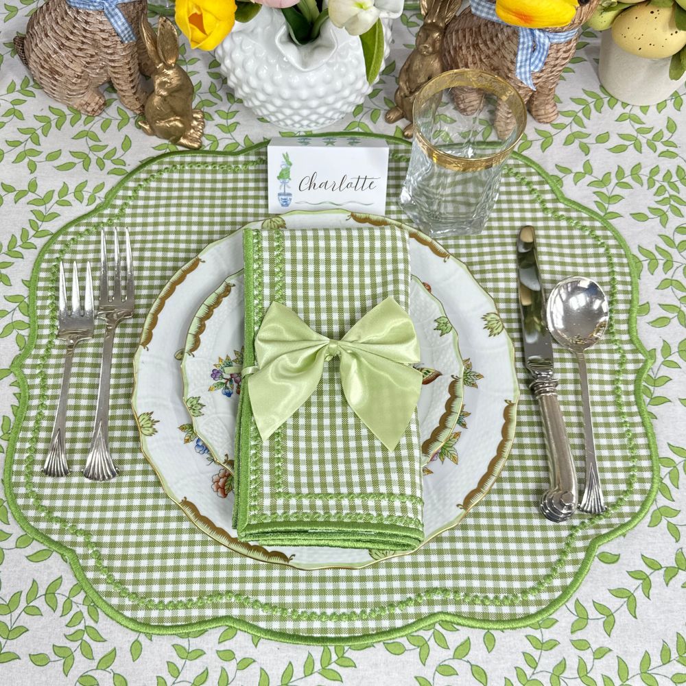 Easter table setting with green gingham placemat, white plate, and matching napkin.Easter Place card