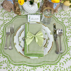 Easter table setting with green gingham placemat, white plate, and matching napkin.Easter Place card