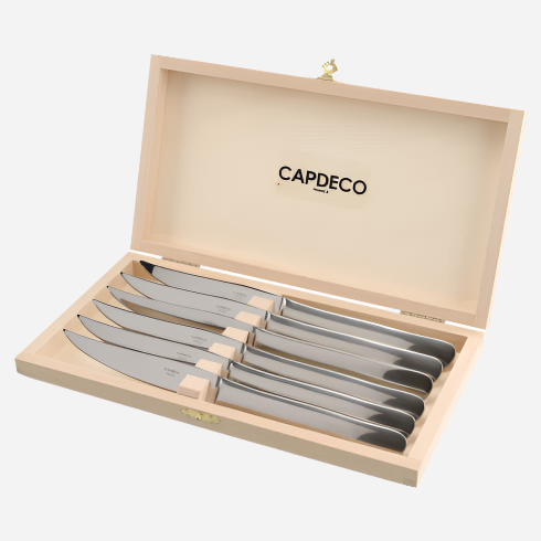 Angled view of Grillade set of 6 steak knives in a light wood presentation box showcasing stainless steel blades and contoured handles