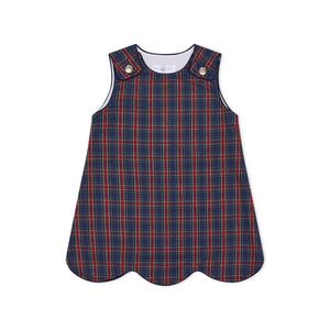 Henry Duvall Janie Jumper girls’ holiday dress in Tinsel Tartan, a navy, red and green plaid with subtle gold metallic thread, scalloped hem, navy piping and gold shoulder buttons.