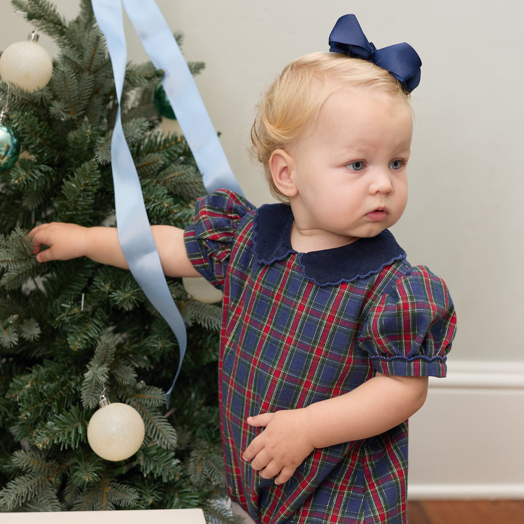 Girls’ Beatrice Bubble in navy, red, and green Tinsel Tartan with subtle metallic thread, Midnight Blue Corduroy scalloped collar, and scalloped sleeve trim.