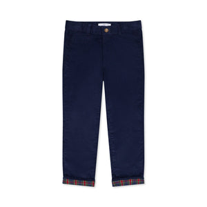 Boys’ Bradford Trousers in Midnight Blue Corduroy, fully lined in Tinsel Tartan with cuffed hems revealing festive navy, red, and green plaid.