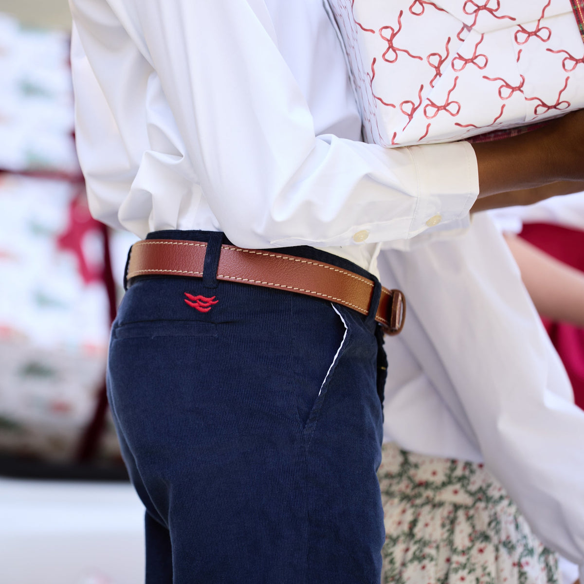Side view of boys’ Bradford Trousers in Midnight Blue Corduroy showing the waistband on a child with a blurred background