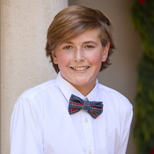 Boys’ pre-tied Baker Bow Tie in navy, red, and green Tinsel Tartan with subtle metallic thread and easy-on clasp.