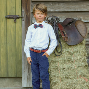 Boys’ pre-tied Baker Bow Tie in navy, red, and green Tinsel Tartan with subtle metallic thread and easy-on clasp.